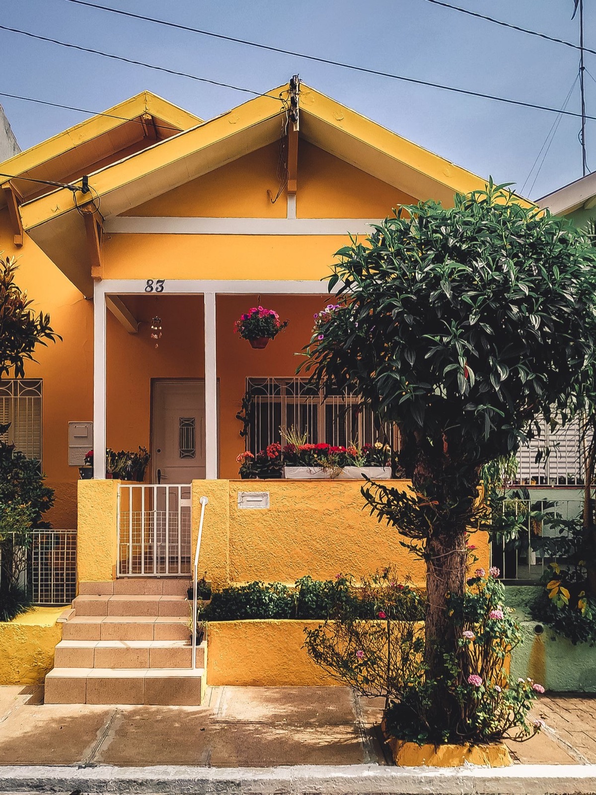 Bright traditional coastal cottage with front porch