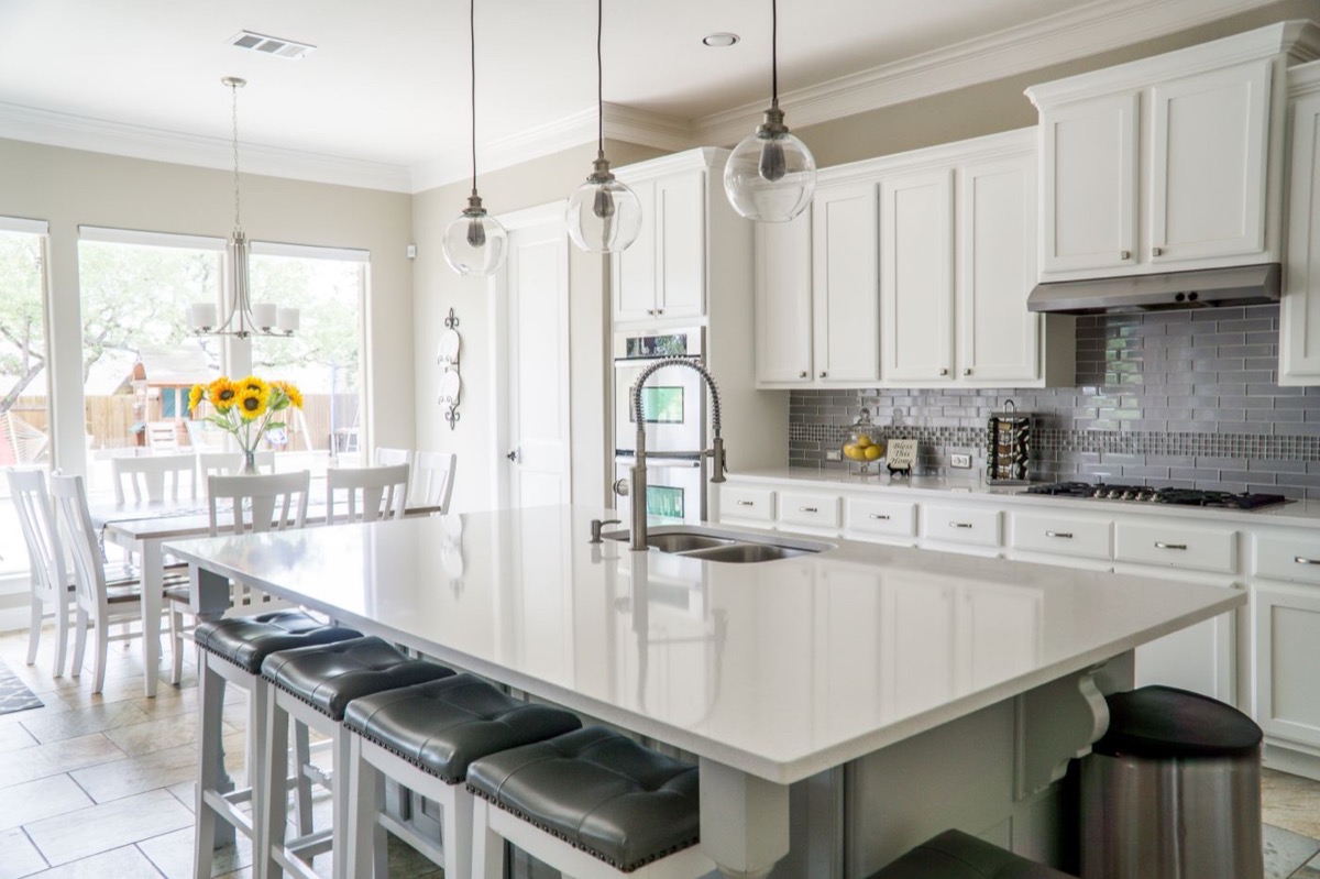 Luxury white kitchen with large island