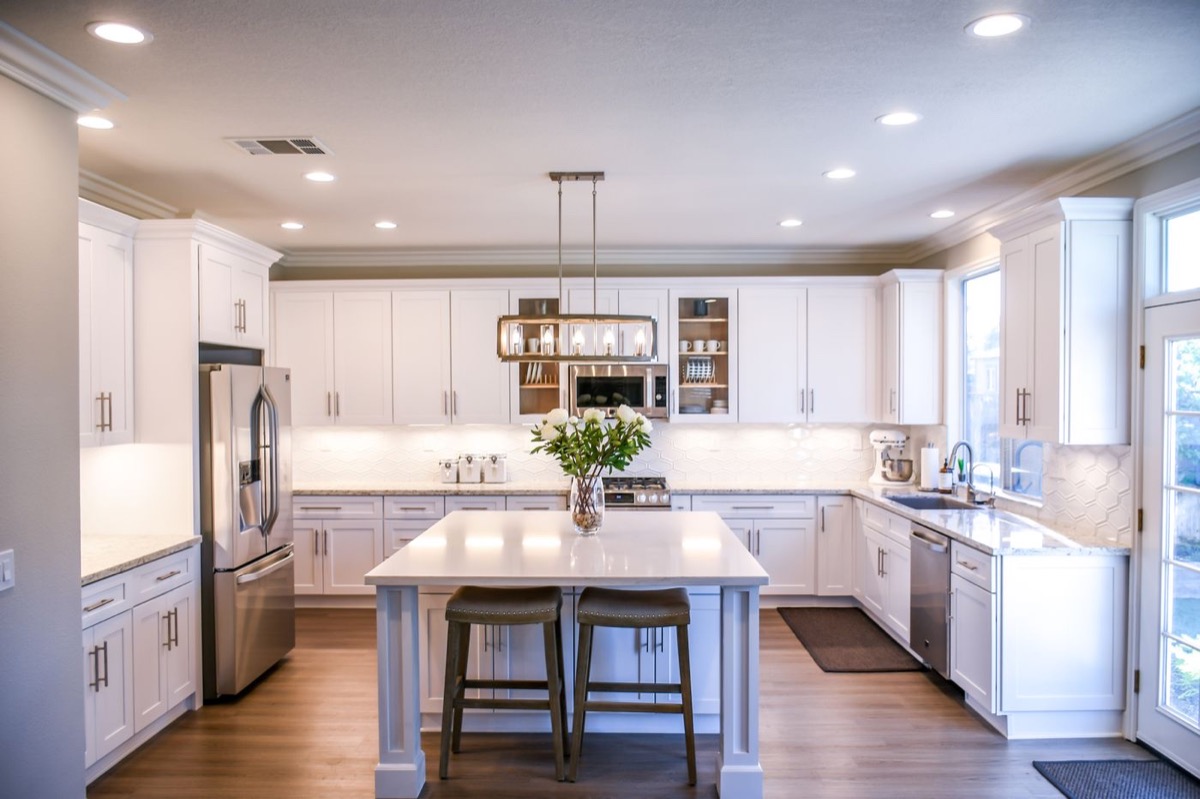 Luxury white kitchen remodel with center island
